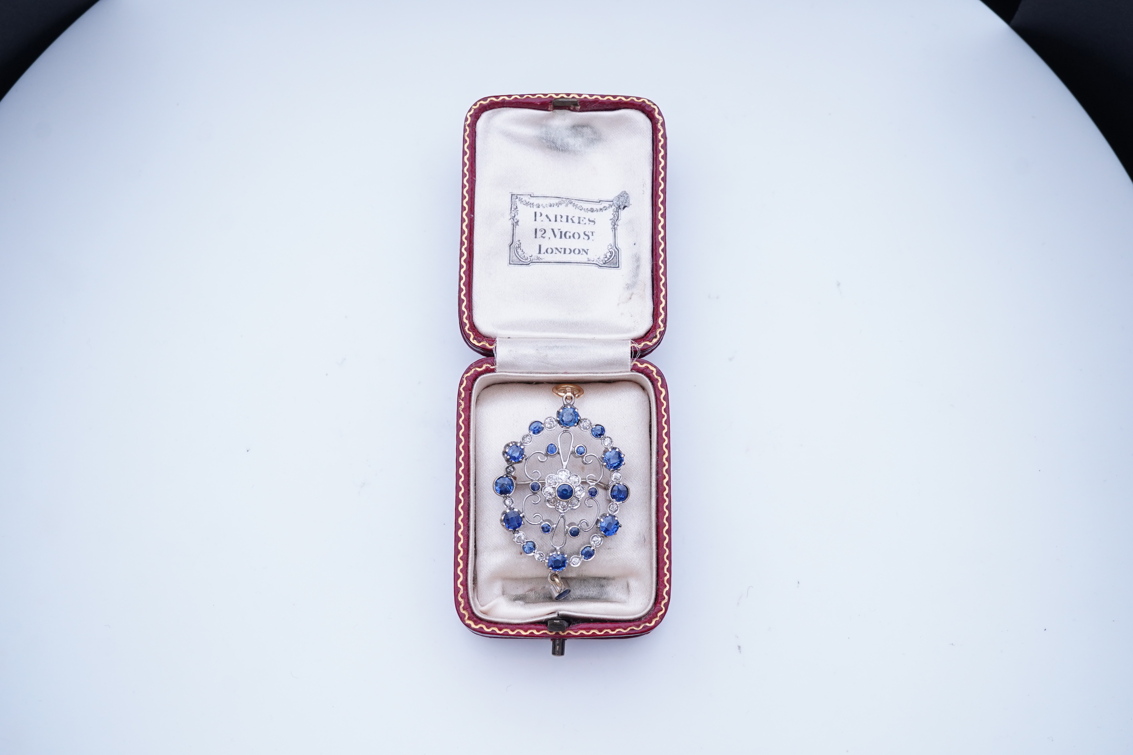 A sapphire and diamond brooch/pendant, mid 20th century